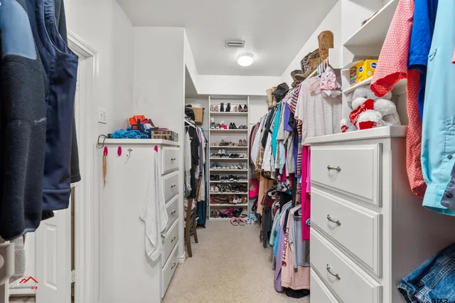 a view of a closet with storage