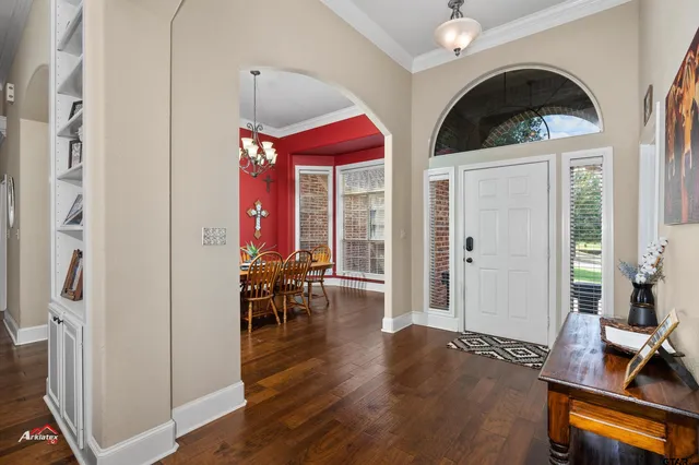 a view of living room with furniture and wooden floor