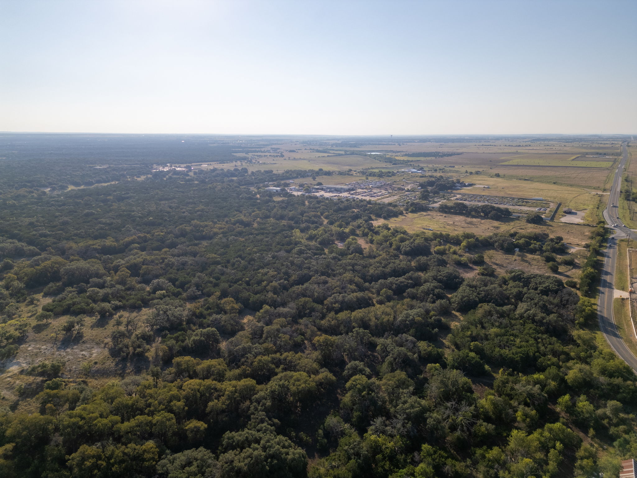112 Loop 308 Briggs, TX 78608 - Photo 8 of 37 an aerial view of house with yard and mountain view in back