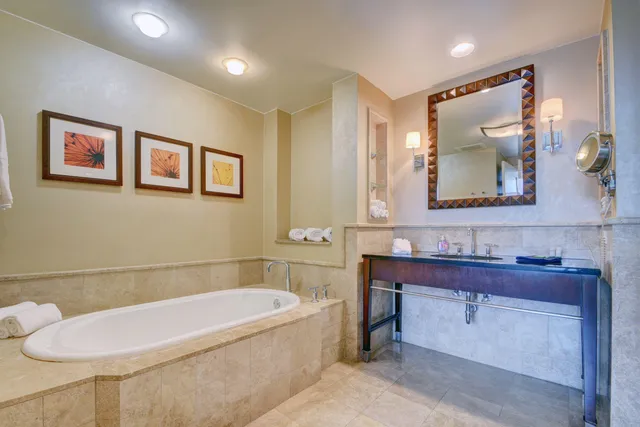 a bathroom with a bathtub and a sink
