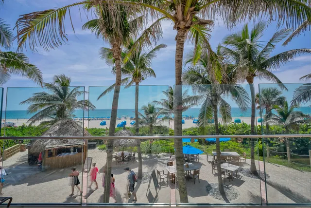 an outdoor space with seating area and trees