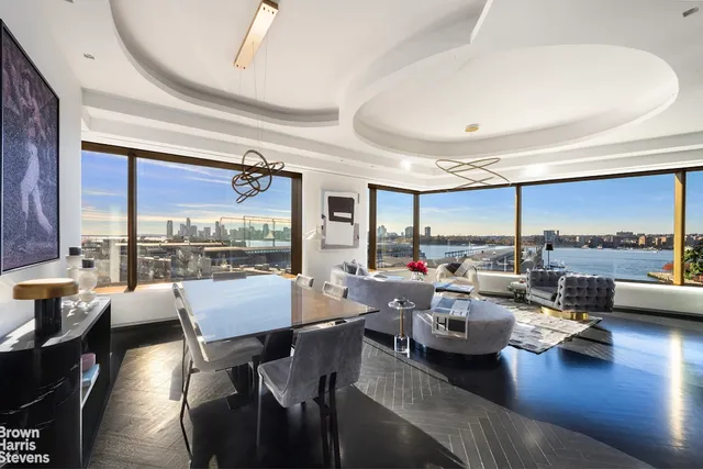 a very nice looking living room with furniture and a large window