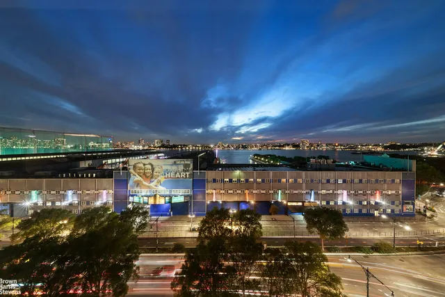 a living room with fireplace furniture and a potted plant