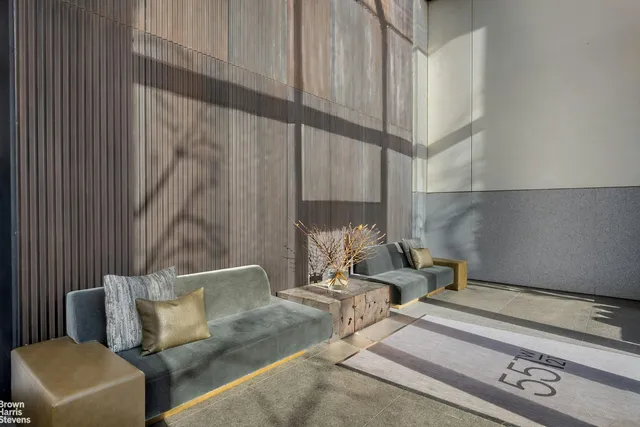 a room with wooden floor and furniture