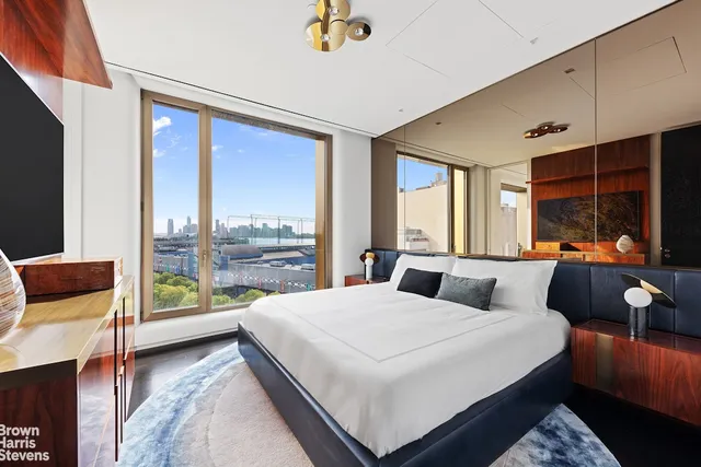 a living room with furniture bathtub and a large window