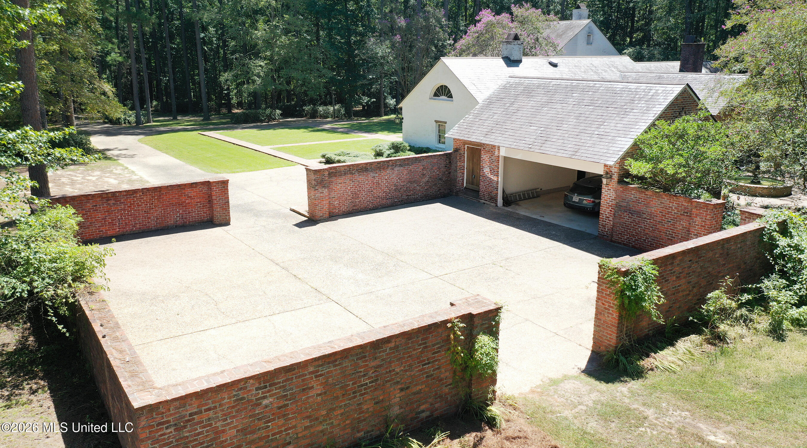 657 Zetus Road Northeast Brookhaven, MS 39601 - Photo 26 of 80 657 dron of motorcourt and garage