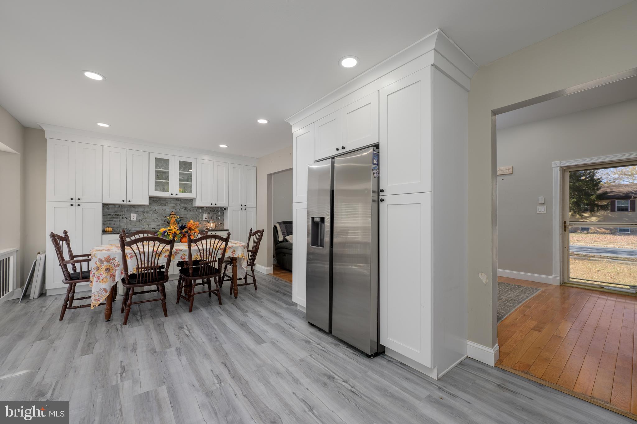 28 Mary Ellen Lane Sicklerville, NJ 08081 - Photo 12 of 46 a kitchen with stainless steel appliances a dining table chairs and wooden floor