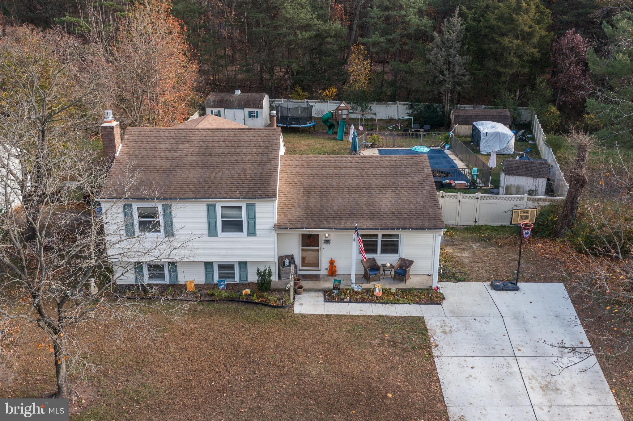 28 Mary Ellen Lane Sicklerville, NJ 08081 - Photo 2 of 46 a aerial view of a house with swimming pool and sitting area