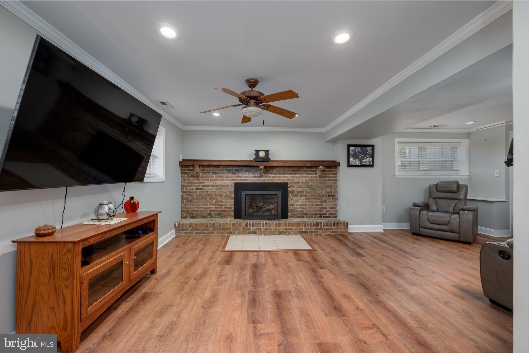 28 Mary Ellen Lane Sicklerville, NJ 08081 - Photo 21 of 46 a living room with furniture and a fireplace