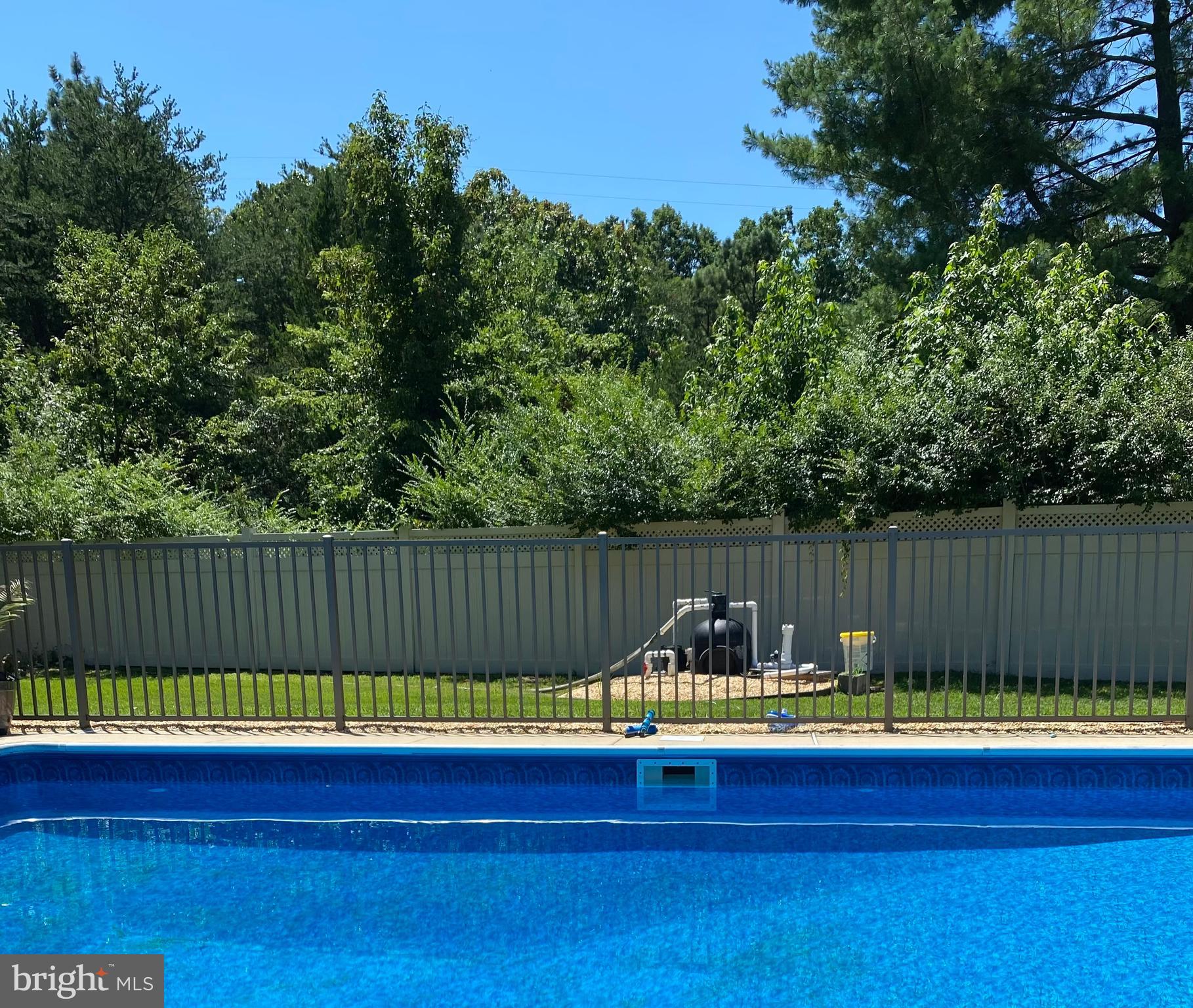 28 Mary Ellen Lane Sicklerville, NJ 08081 - Photo 30 of 46 a view of swimming pool with a wooden fence