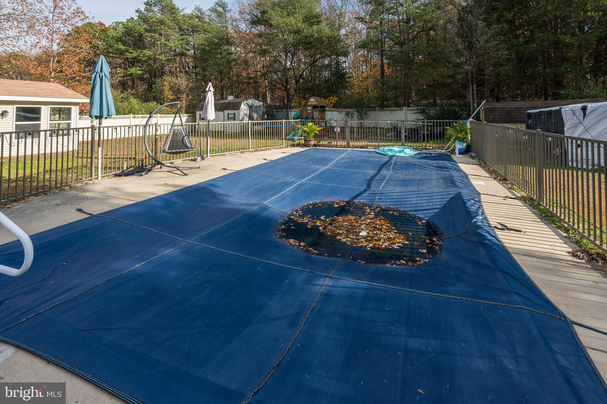28 Mary Ellen Lane Sicklerville, NJ 08081 - Photo 32 of 46 a view of a swimming pool with a patio