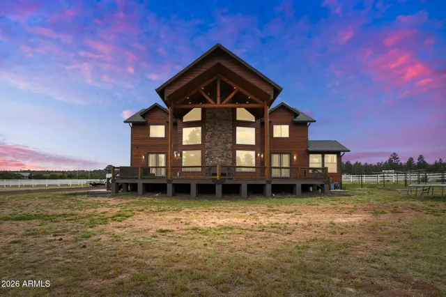 a backyard of a house with a yard and a fountain