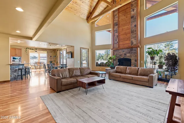 a large kitchen with stainless steel appliances granite countertop a stove and a refrigerator