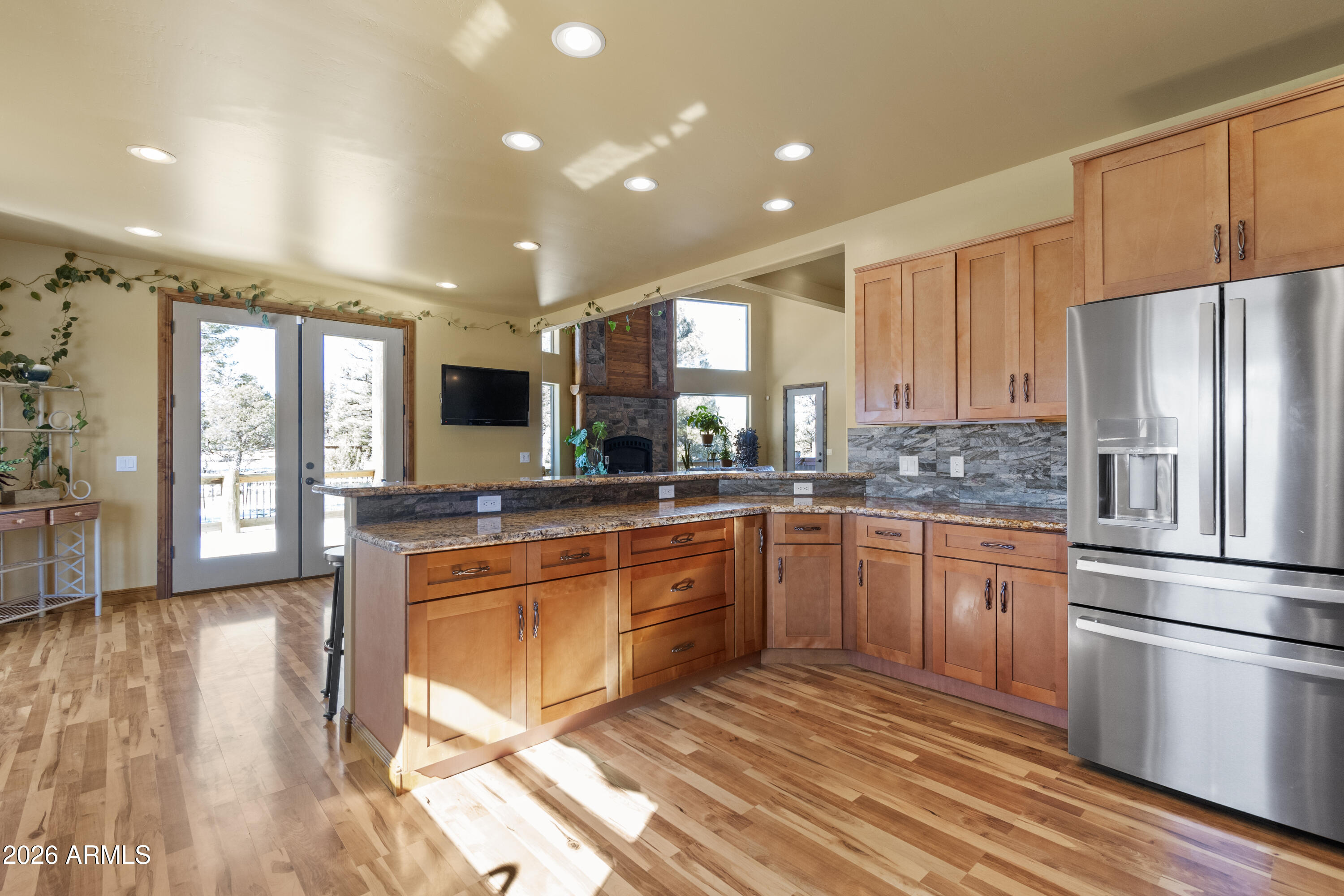 816 Fern Way Show Low, AZ 85901 - Photo 15 of 88 a large kitchen with stainless steel appliances granite countertop a stove and a refrigerator