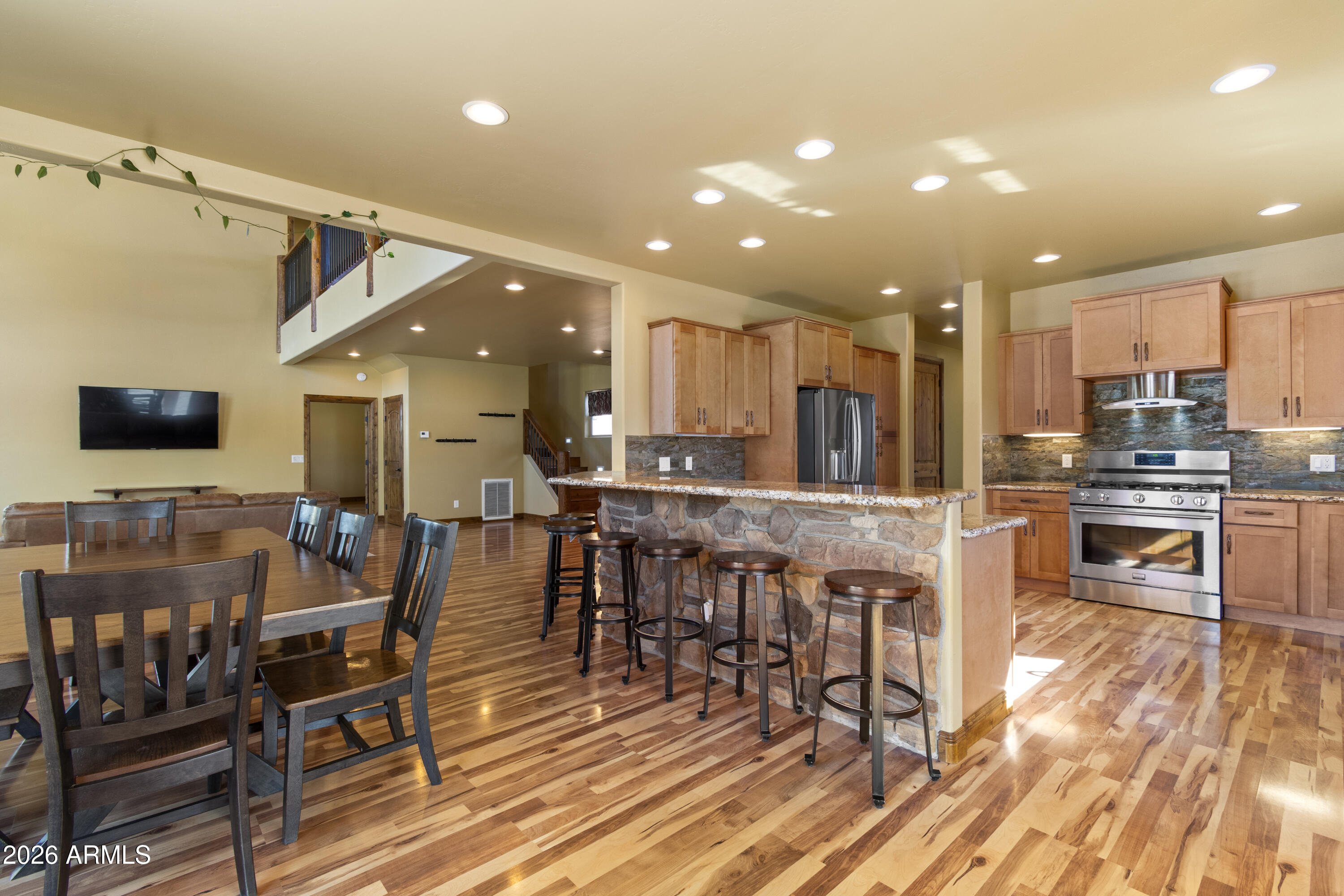 816 Fern Way Show Low, AZ 85901 - Photo 18 of 88 a view of a dining room with furniture and wooden floor