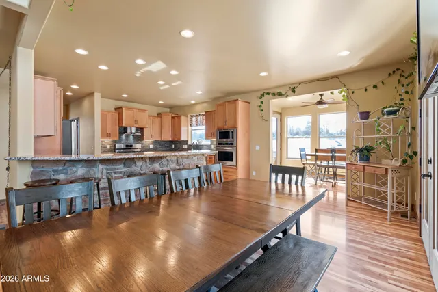 a spacious bathroom with a granite countertop sink and a mirror
