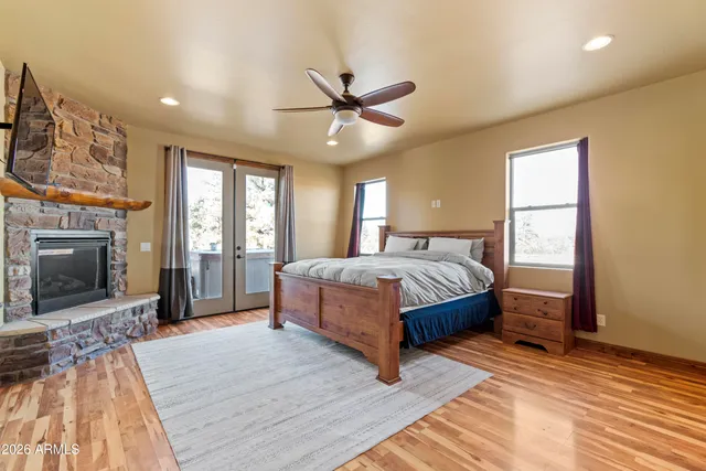 a kitchen with a sink cabinets and wooden floor