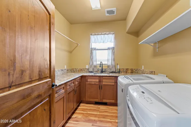 a bedroom with a large bed and a fireplace