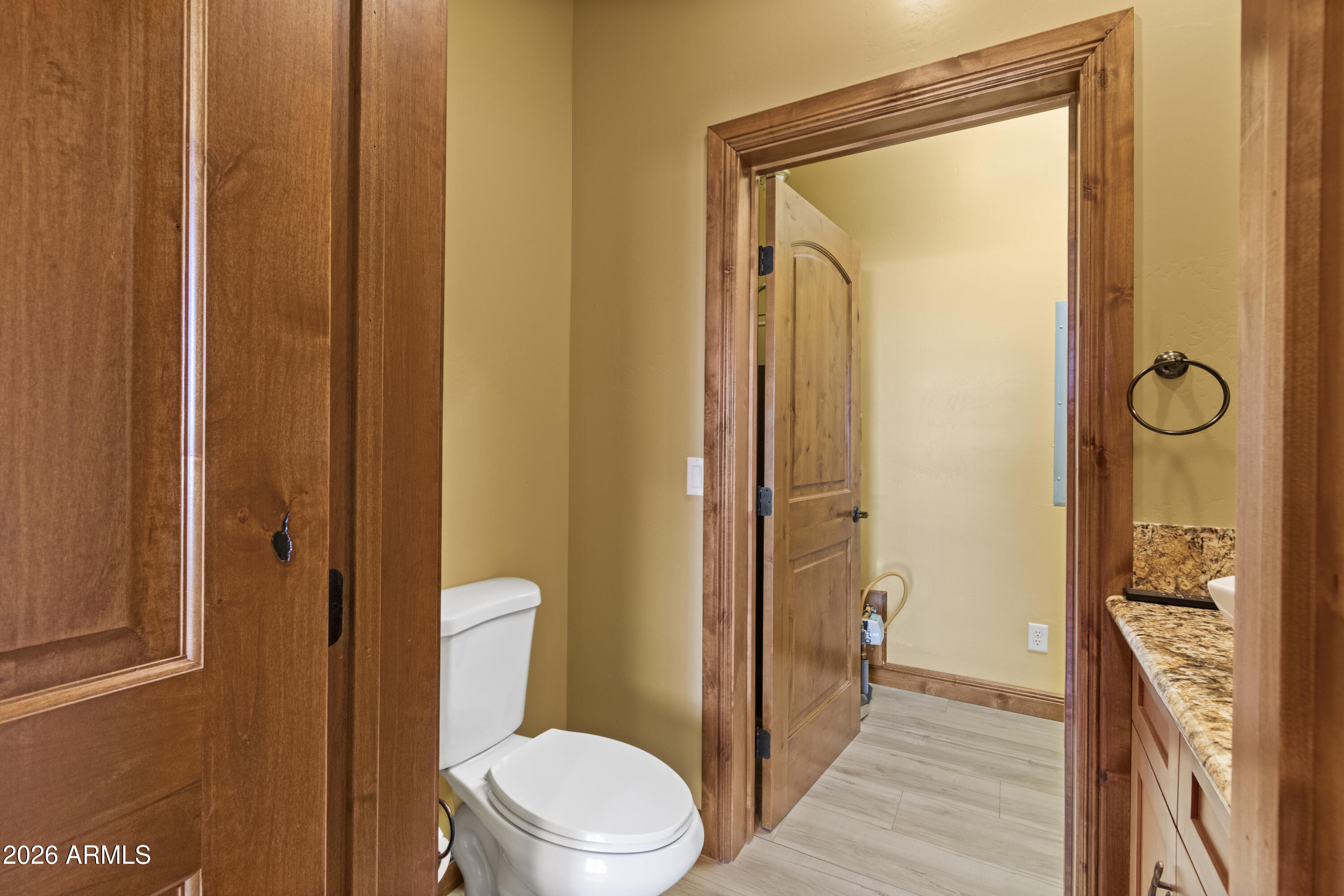 816 Fern Way Show Low, AZ 85901 - Photo 31 of 88 a bathroom with a granite countertop sink a toilet and shower