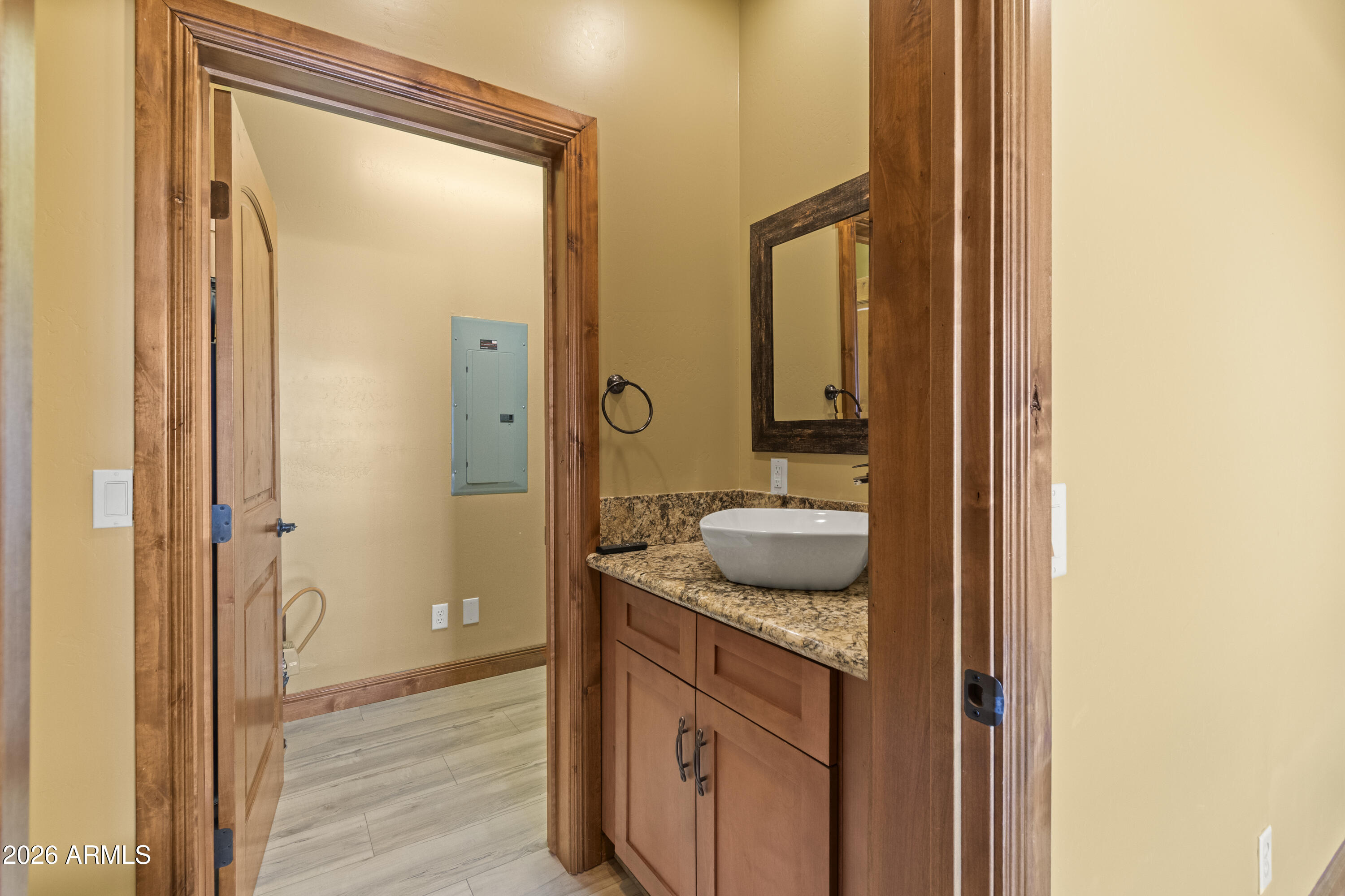816 Fern Way Show Low, AZ 85901 - Photo 34 of 93 a bathroom with a granite countertop sink and a mirror