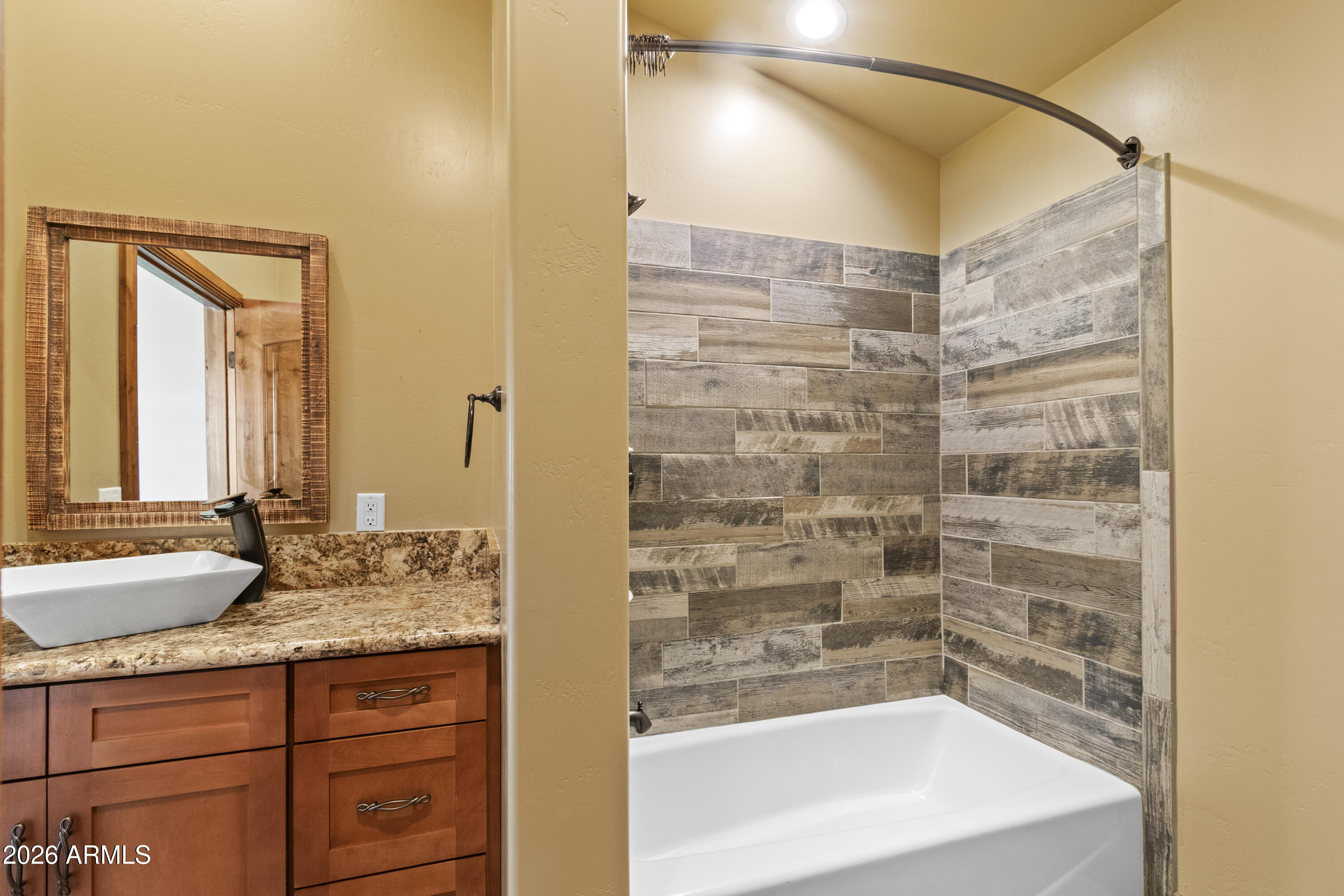 816 Fern Way Show Low, AZ 85901 - Photo 44 of 93 a bathroom with a granite countertop sink and a bathtub