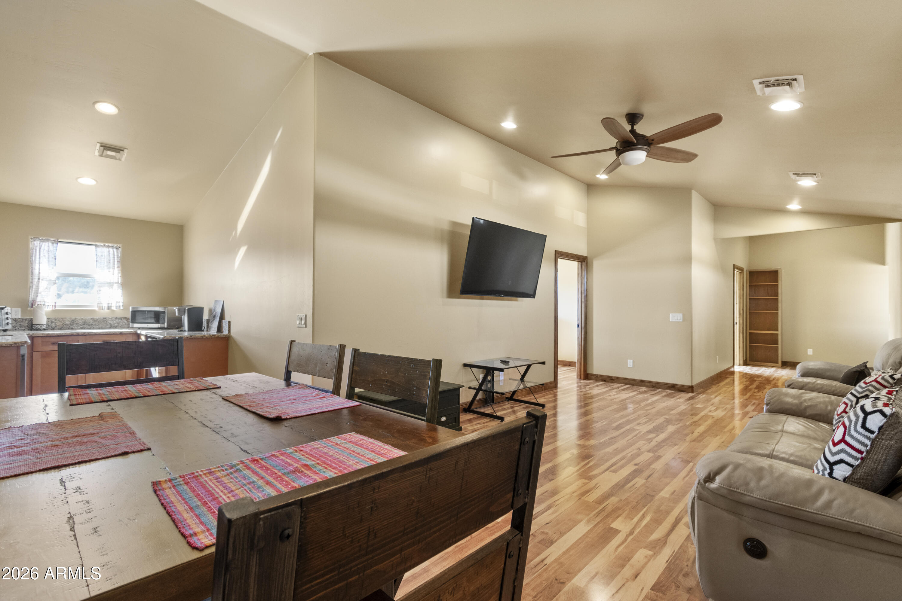 816 Fern Way Show Low, AZ 85901 - Photo 48 of 93 a living room with furniture and a flat screen tv