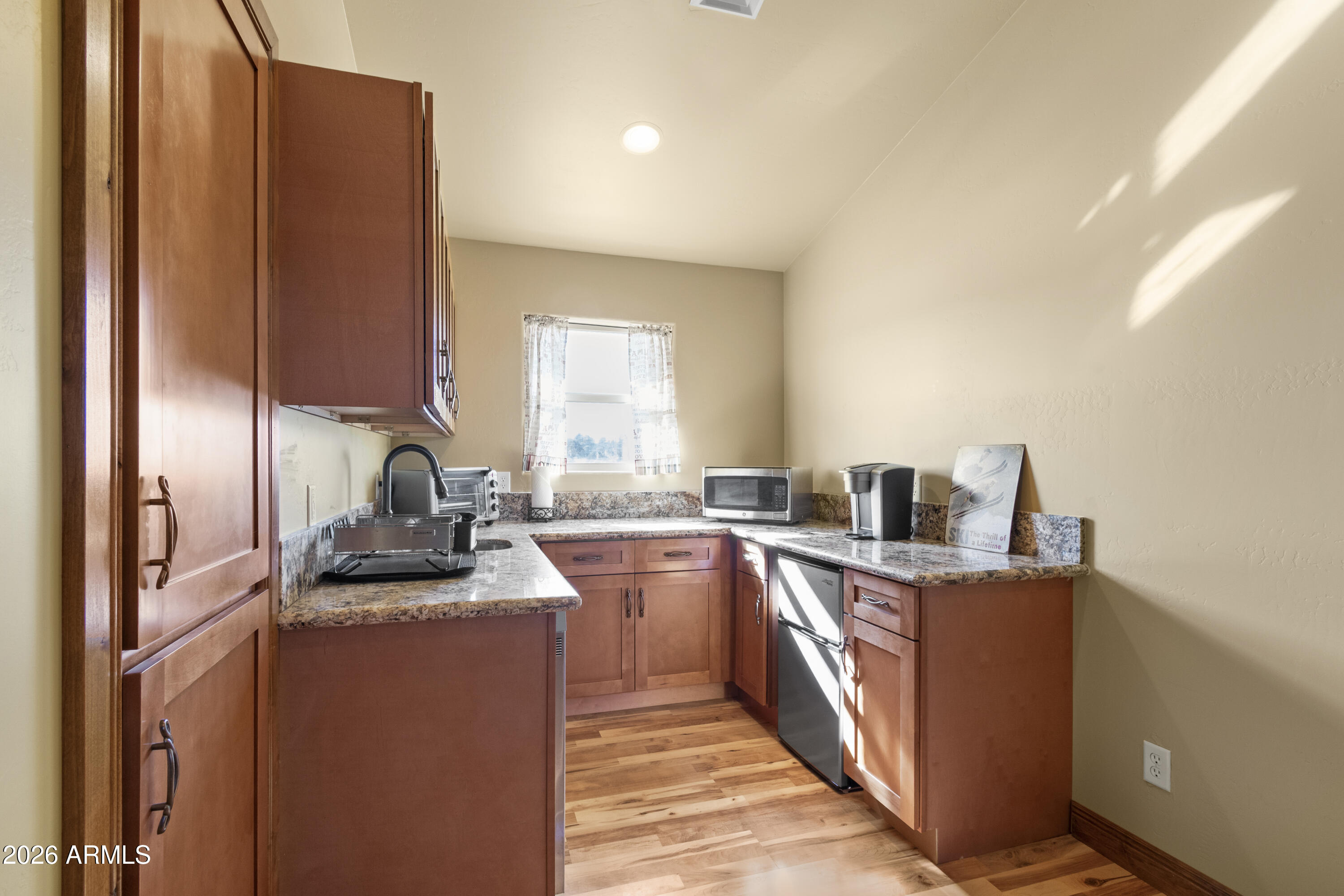 816 Fern Way Show Low, AZ 85901 - Photo 51 of 88 a kitchen with sink cabinets and stove top oven