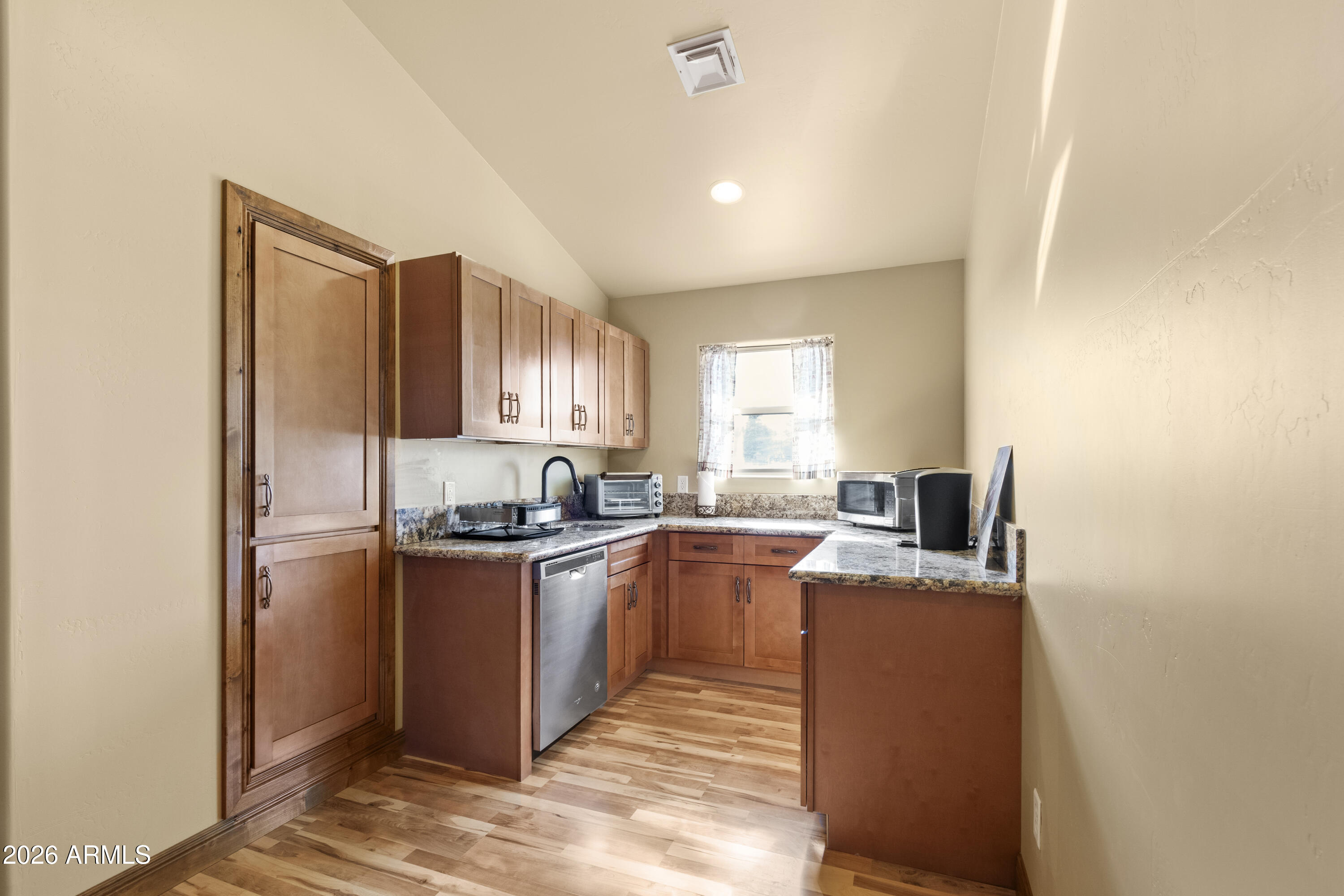 816 Fern Way Show Low, AZ 85901 - Photo 54 of 93 a kitchen with stainless steel appliances granite countertop a stove top oven a sink dishwasher and a refrigerator