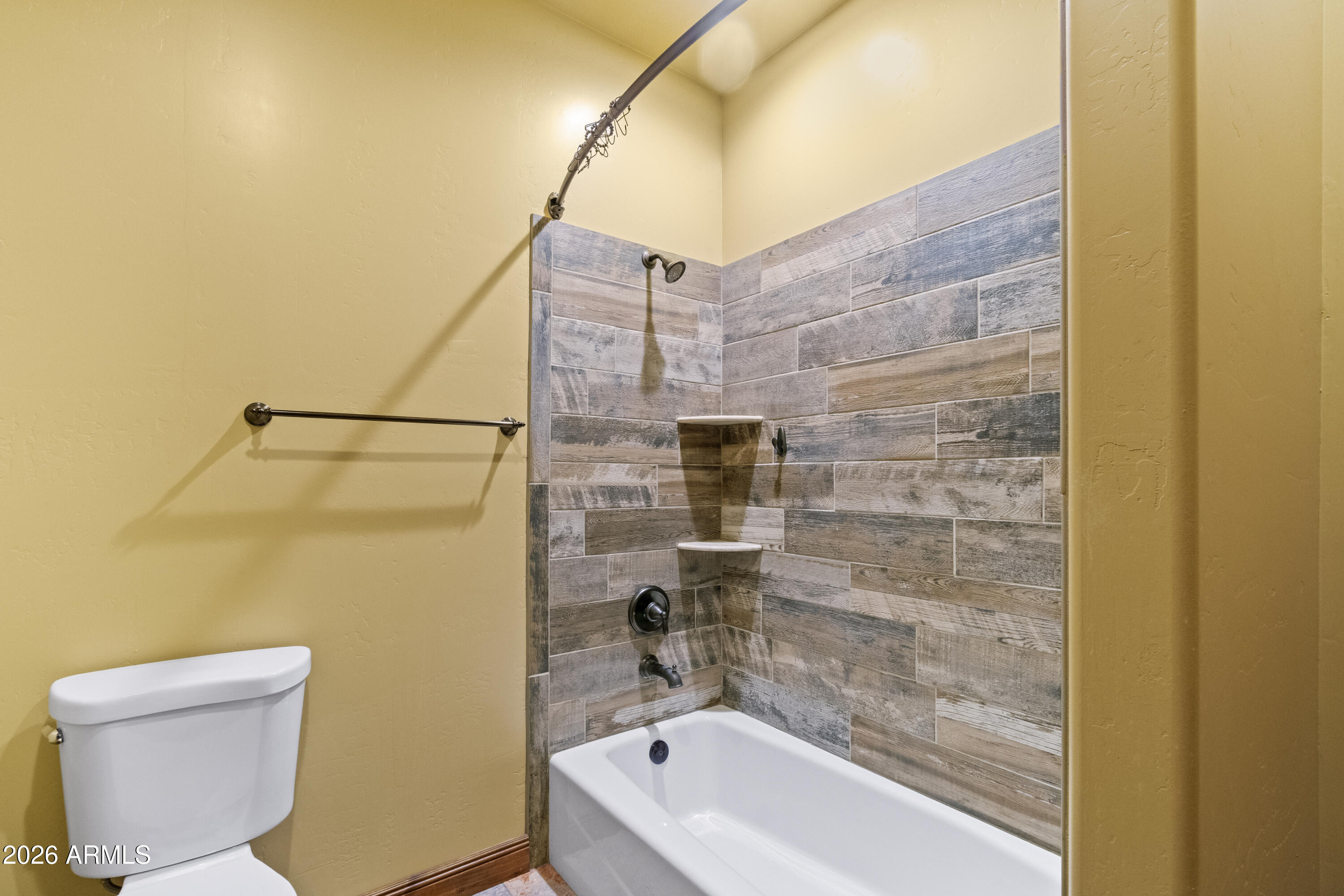 816 Fern Way Show Low, AZ 85901 - Photo 56 of 88 a bathroom with a bathtub and a shower