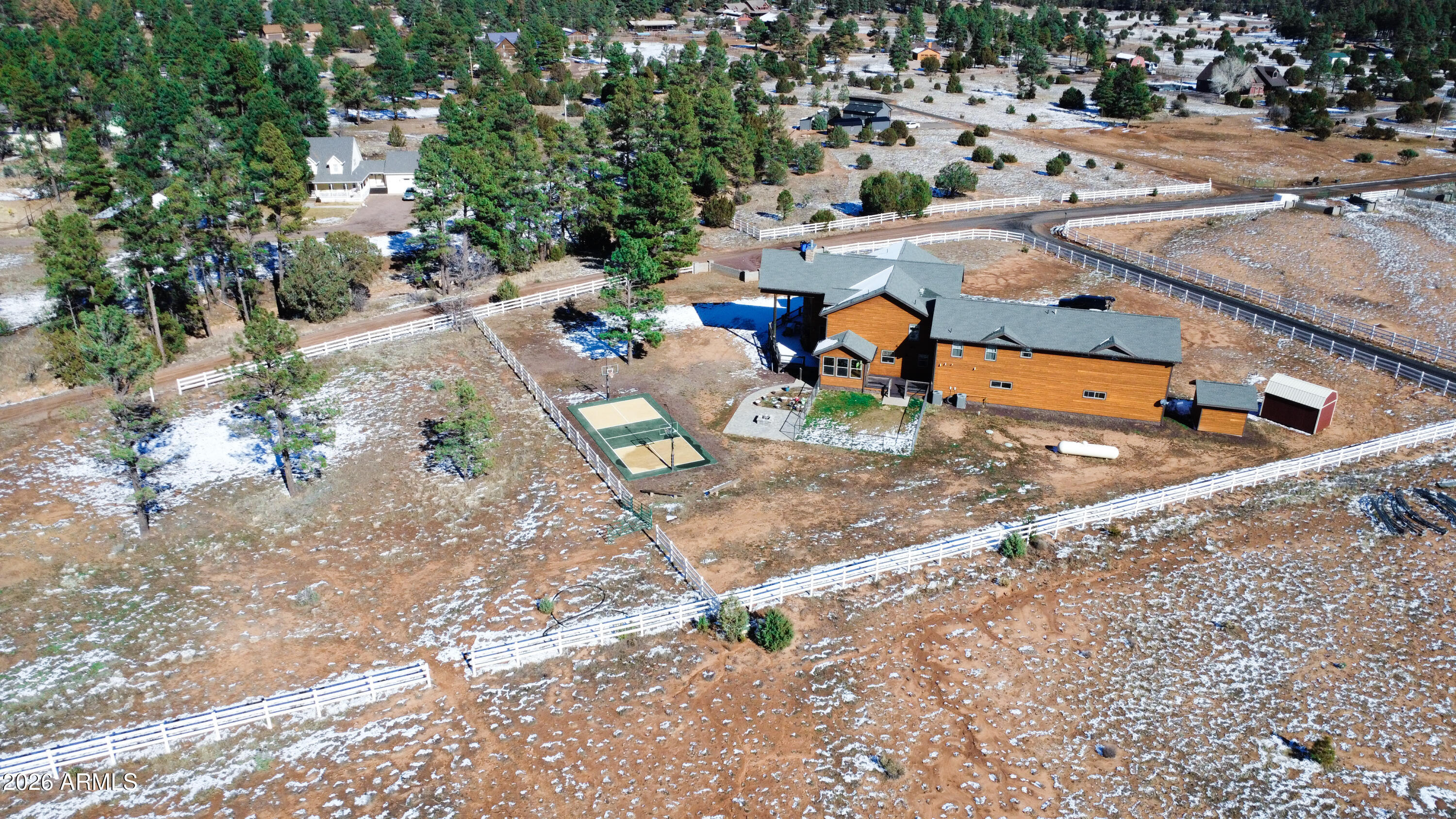 816 Fern Way Show Low, AZ 85901 - Photo 5 of 88 an aerial view of a yard with basket ball court