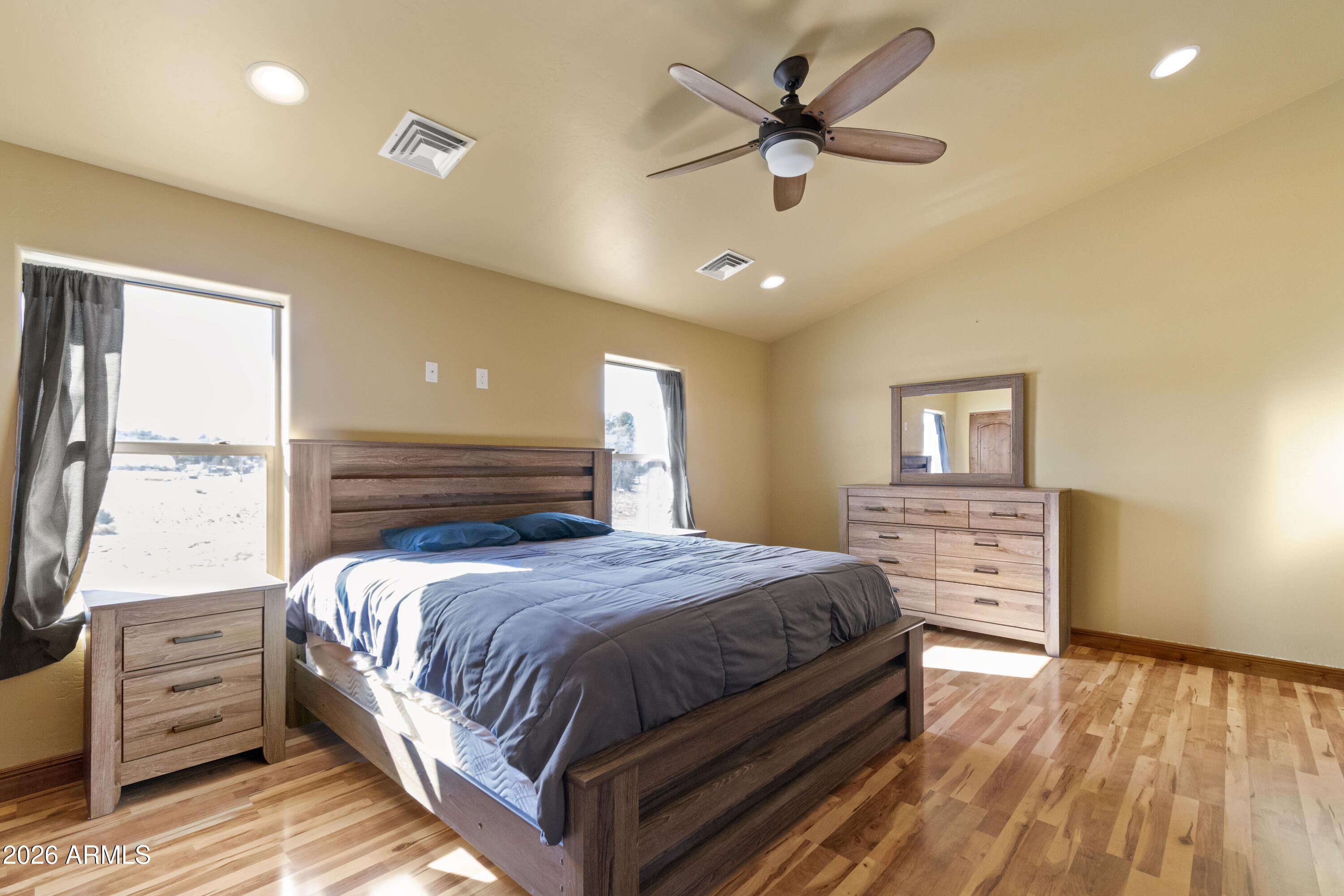 816 Fern Way Show Low, AZ 85901 - Photo 61 of 93 a bedroom with a large bed and a window