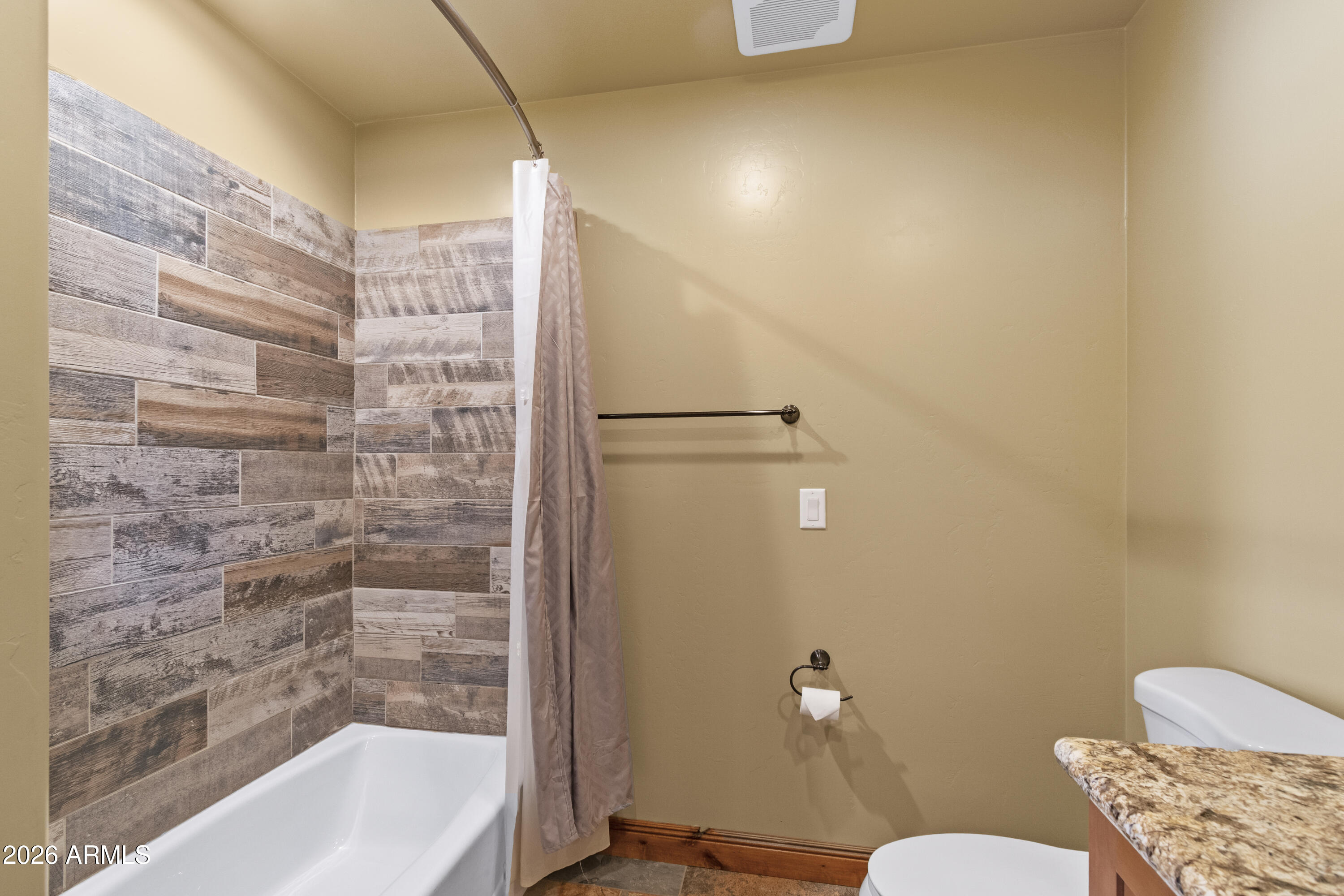 816 Fern Way Show Low, AZ 85901 - Photo 64 of 93 a bathroom with a granite countertop bathtub shower and toilet