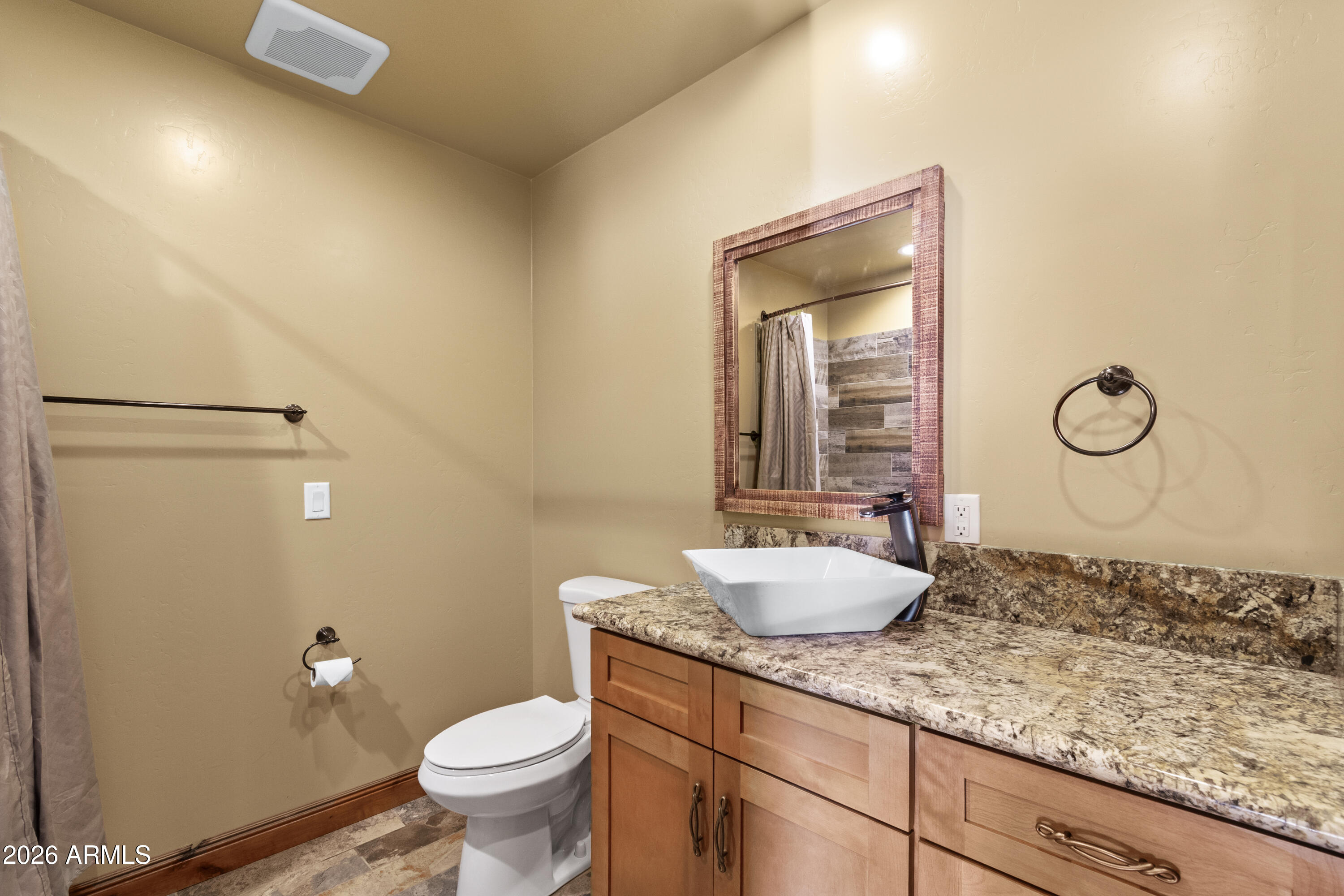 816 Fern Way Show Low, AZ 85901 - Photo 65 of 93 a bathroom with a granite countertop sink mirror vanity and toilet