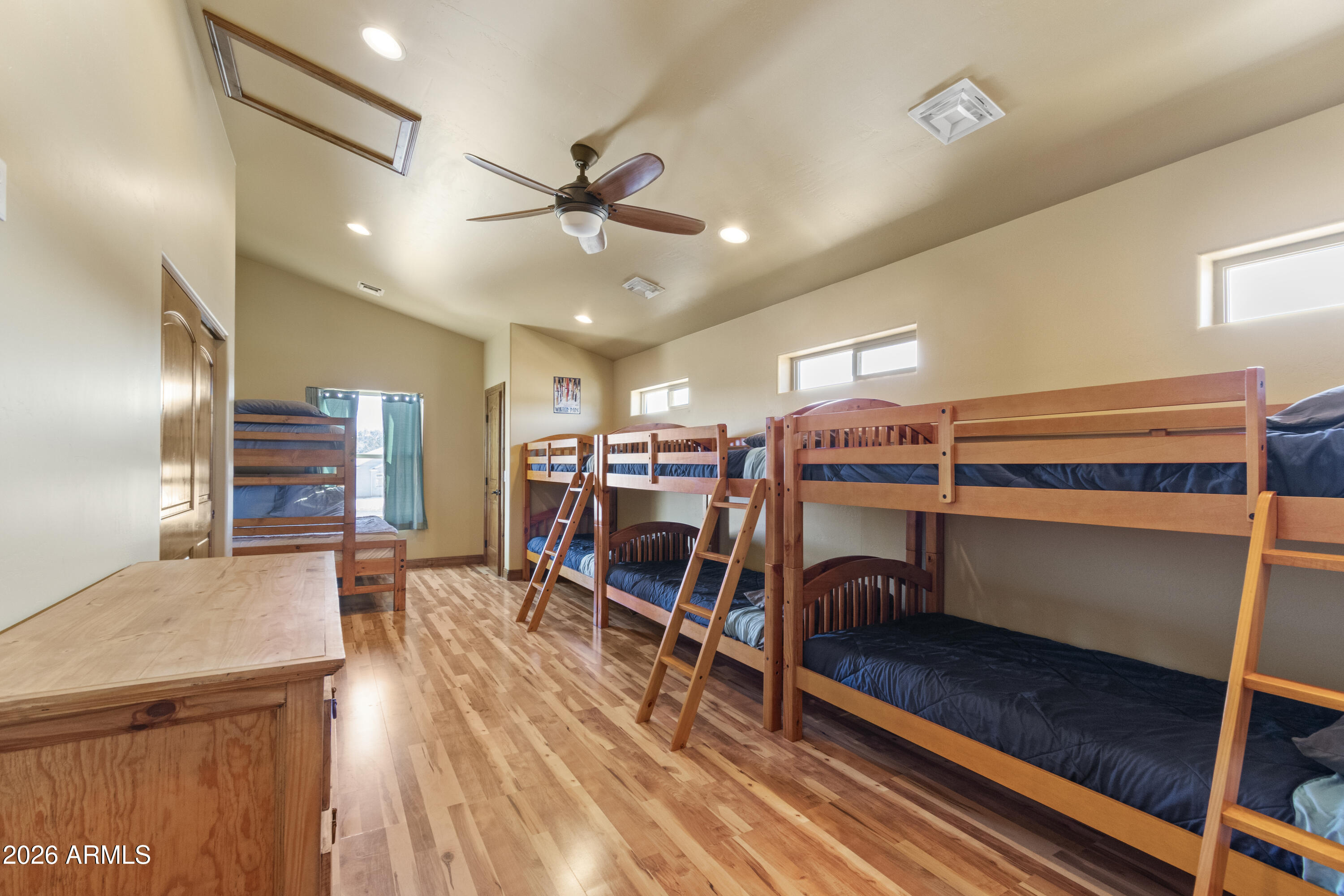 816 Fern Way Show Low, AZ 85901 - Photo 72 of 93 a bedroom with furniture and wooden floors