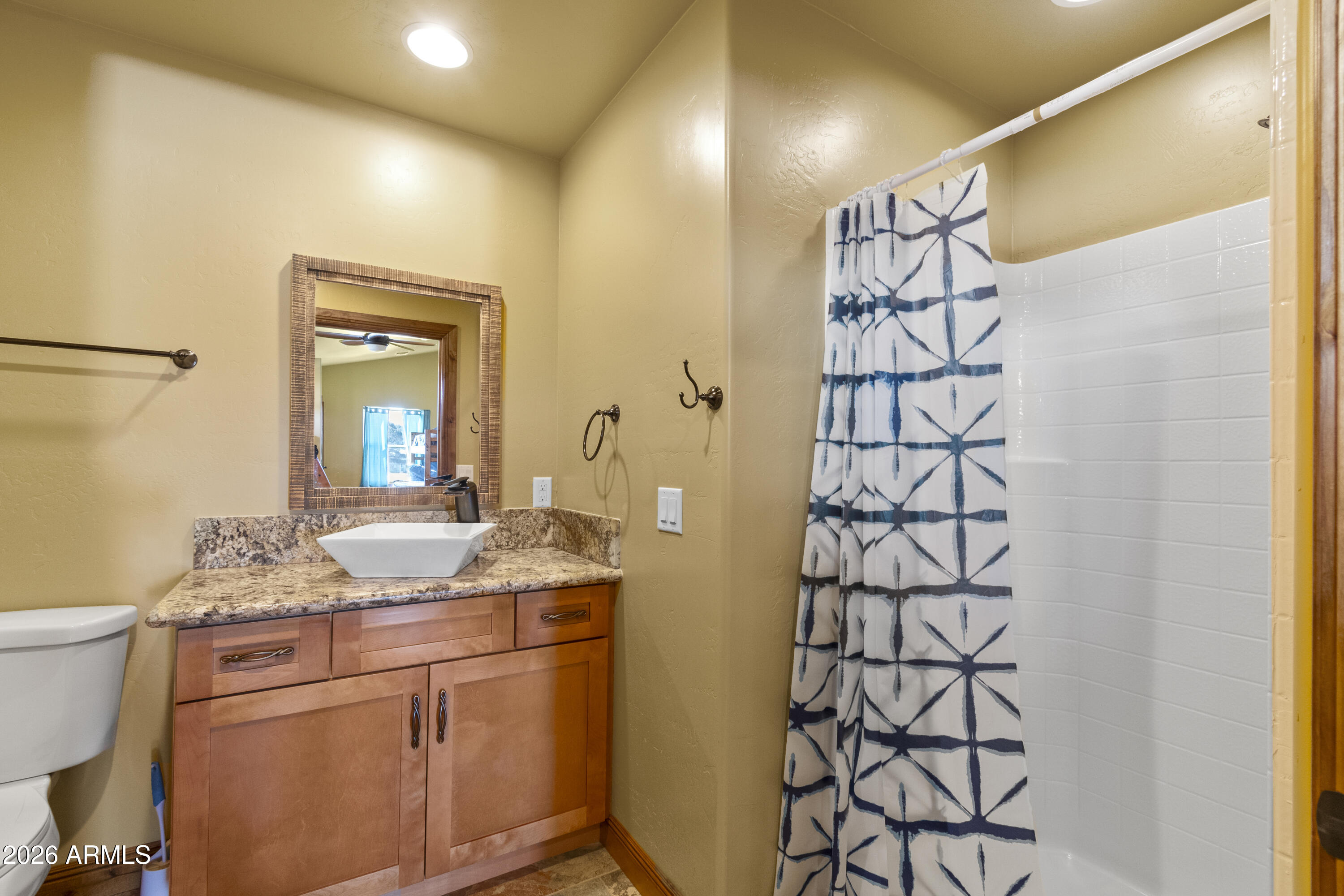 816 Fern Way Show Low, AZ 85901 - Photo 74 of 93 a bathroom with a granite countertop sink and a mirror