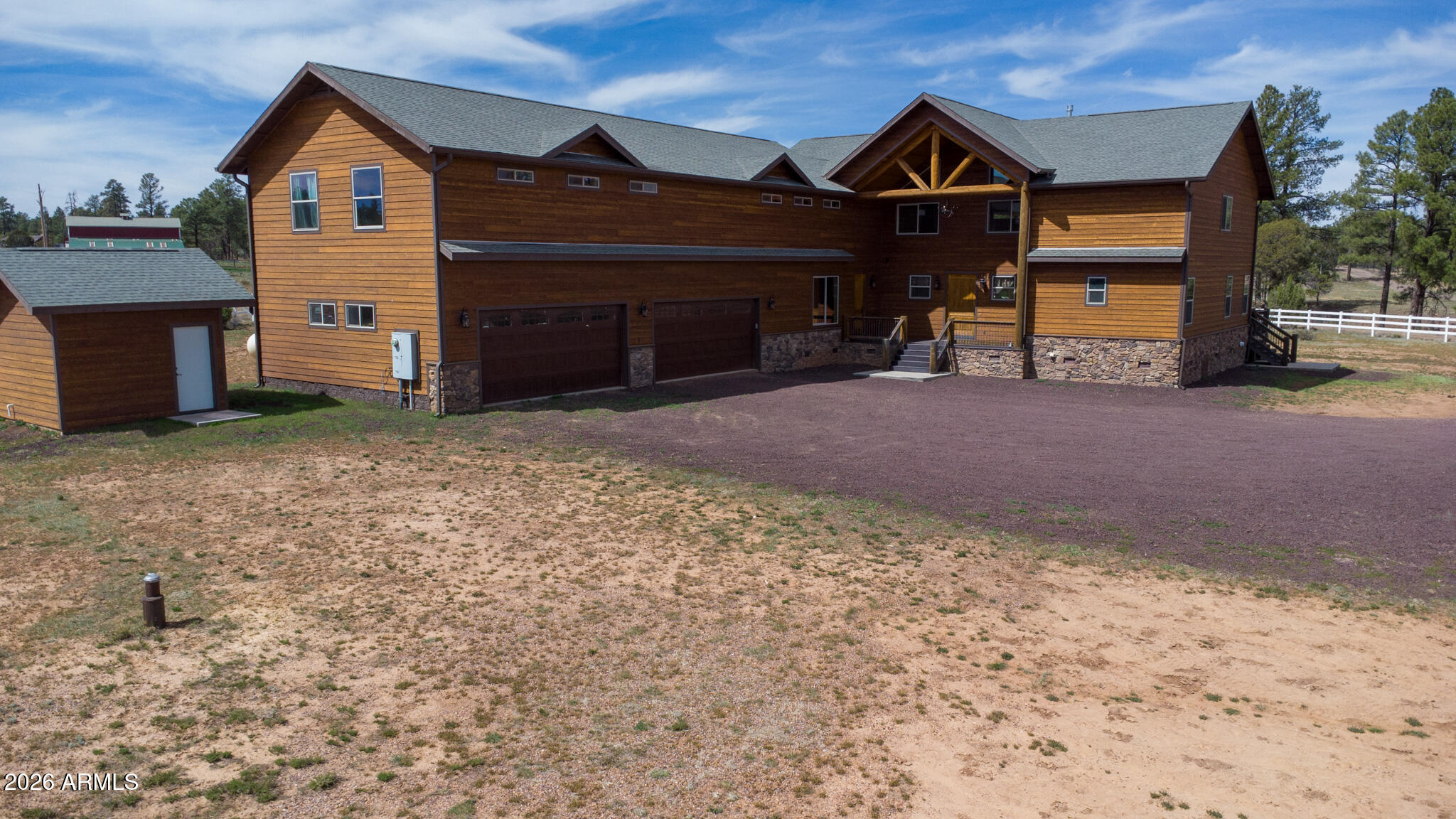 816 Fern Way Show Low, AZ 85901 - Photo 8 of 93 a front view of a house with a yard and garage