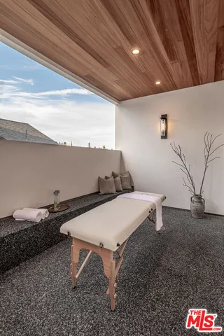 a bedroom with a bed and a table