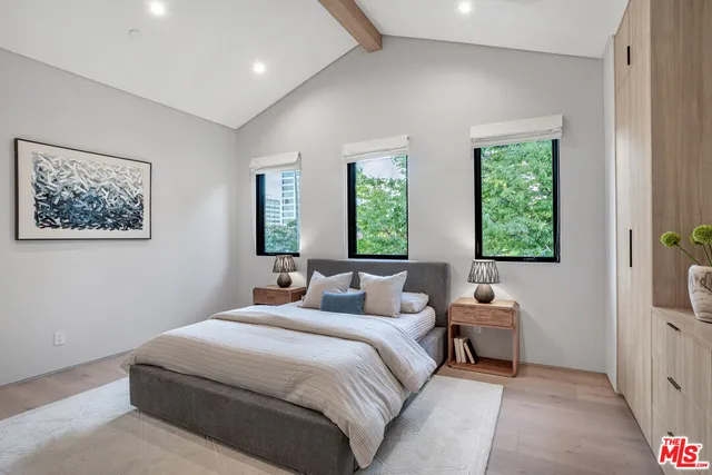 a bedroom with a bed and a couch