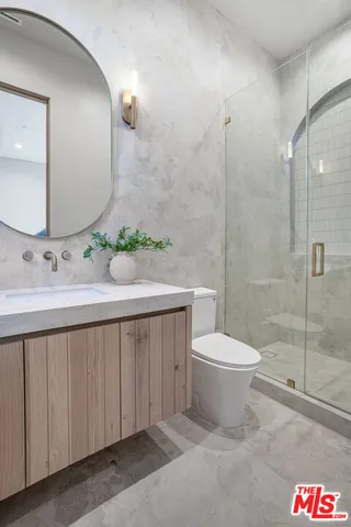 a bedroom with two beds and a window