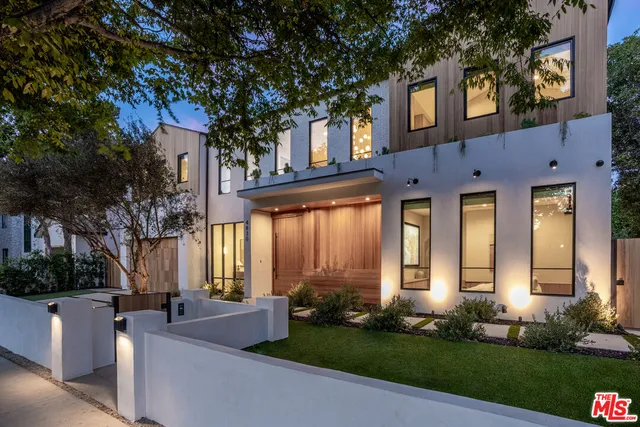 a view of a house with a tree