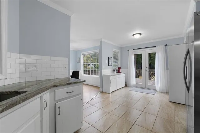a bathroom with a sink mirror and window
