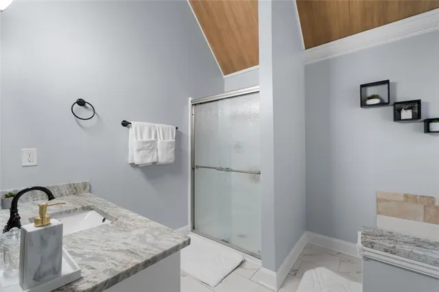 a white bath tub sitting next to a white toilet