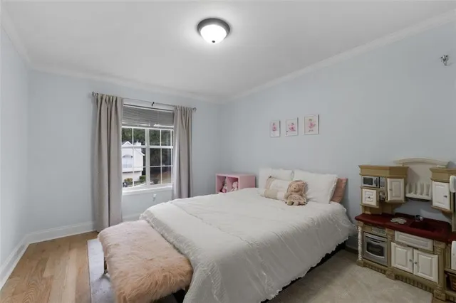 a bedroom with a bed and a cabinets