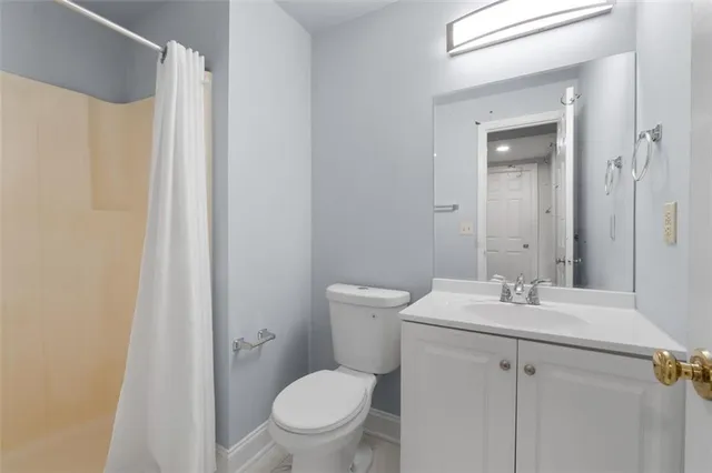 a view of a room with wooden floor and cabinet
