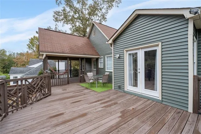 a view of balcony with furniture and wooden deck