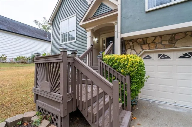 a view of balcony with wooden floor and fence