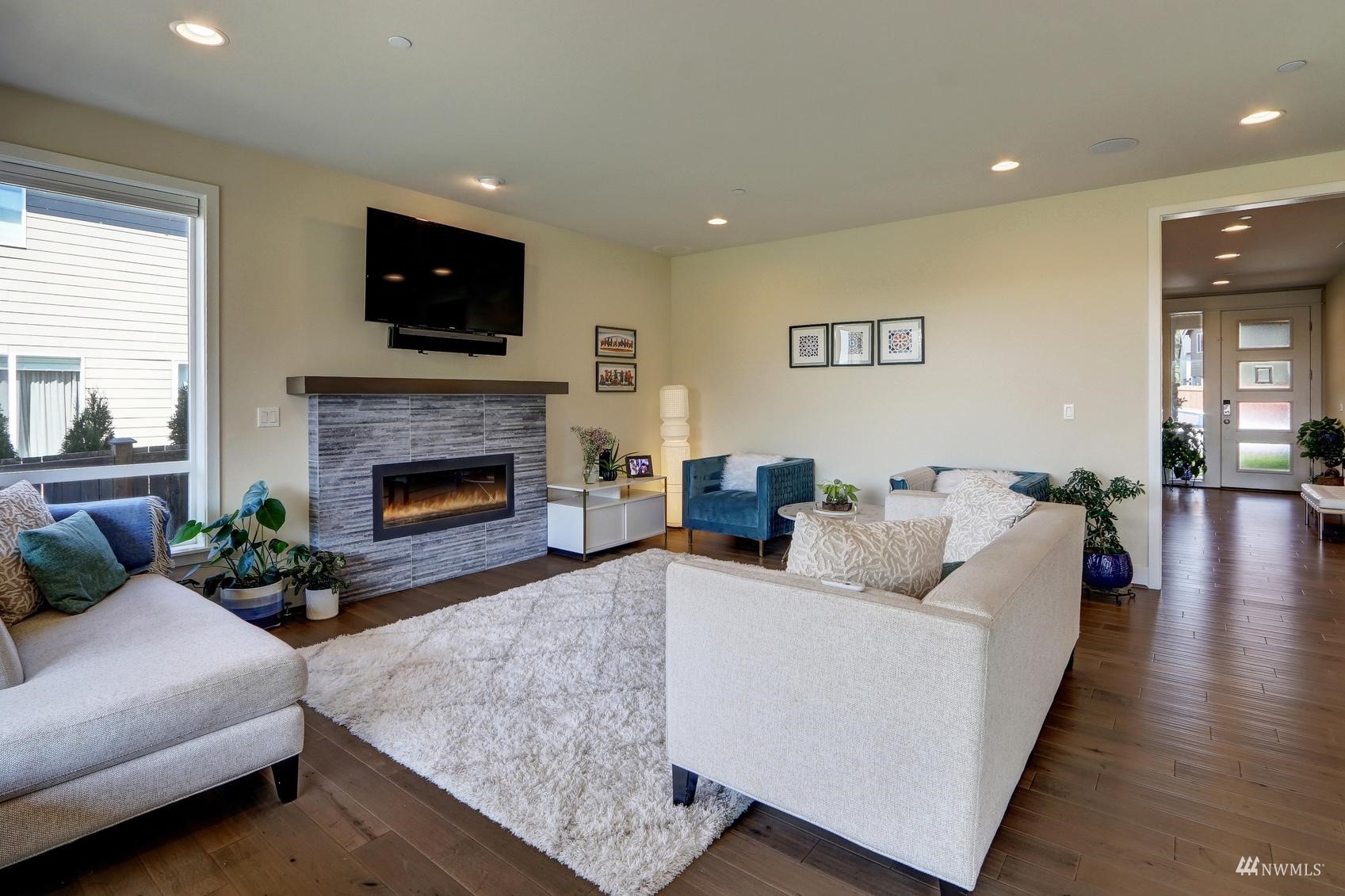 4321 231st Place Southeast Bothell, WA 98021 - Photo 12 of 40 a living room with furniture and a fireplace
