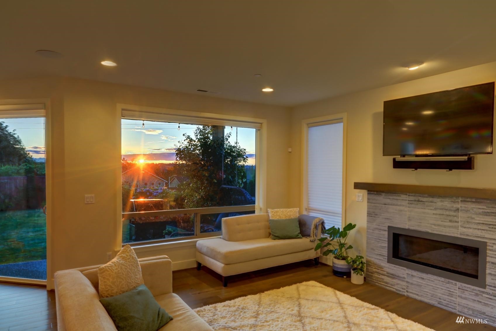4321 231st Place Southeast Bothell, WA 98021 - Photo 14 of 40 a living room with furniture and a flat screen tv
