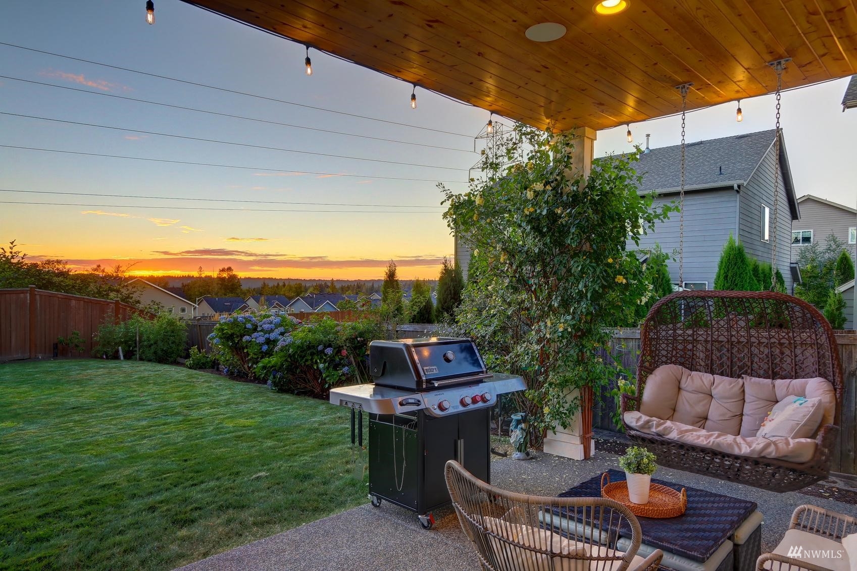4321 231st Place Southeast Bothell, WA 98021 - Photo 17 of 40 a view of a patio with couches table and chairs and potted plants