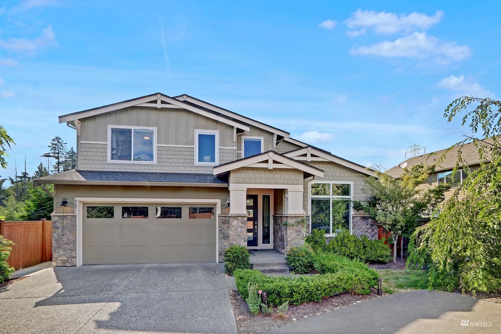 4321 231st Place Southeast Bothell, WA 98021 - Photo 2 of 40 a front view of a house with a yard